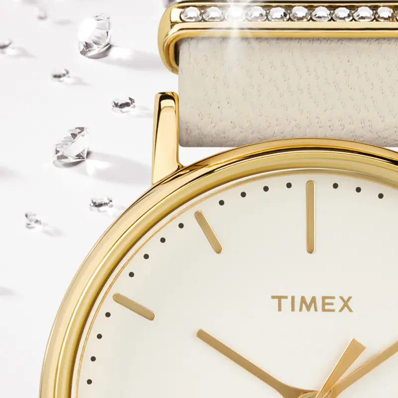 TIMEX Damenuhr mit goldenem Messinggehäuse und weißem Lederarmband