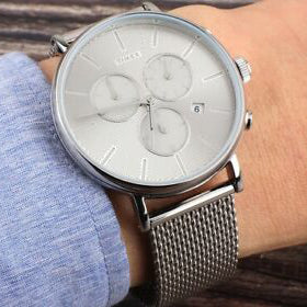 TIMEX Fairfield TW2R97900 - ساعة رجالية فضية أنيقة مع إضاءة ليلية INDIGLO وتصميم نحاسي متين