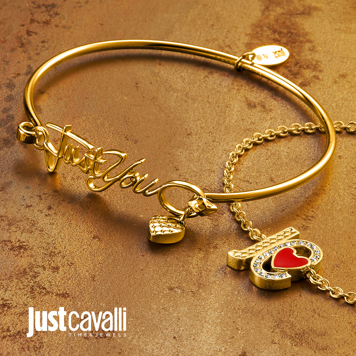a close up of a gold bracelet with charms