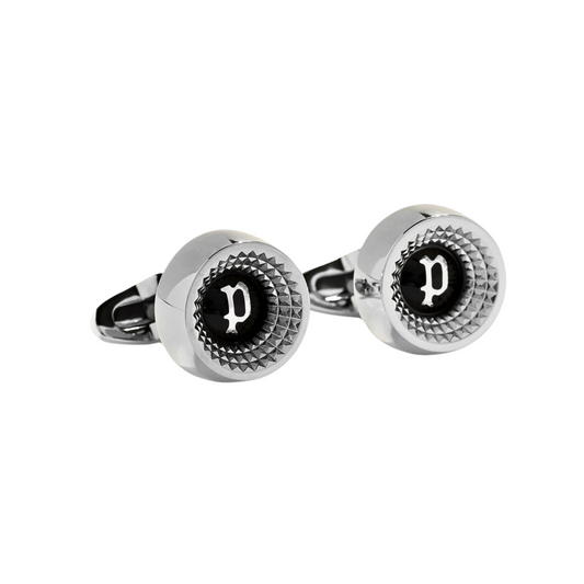 a pair of black and white cufflinks with the letter d on them